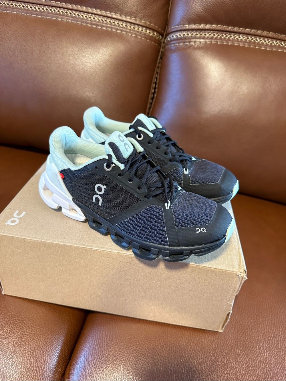 On Running Women's Black and Light Mint Cloudrunner Sneakers